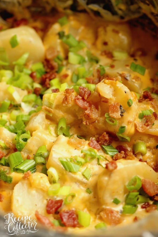 Slow Cooker Loaded Potatoes - An easy side dish recipe filled with all the yummy baked potato toppings and perfect for any time of year!