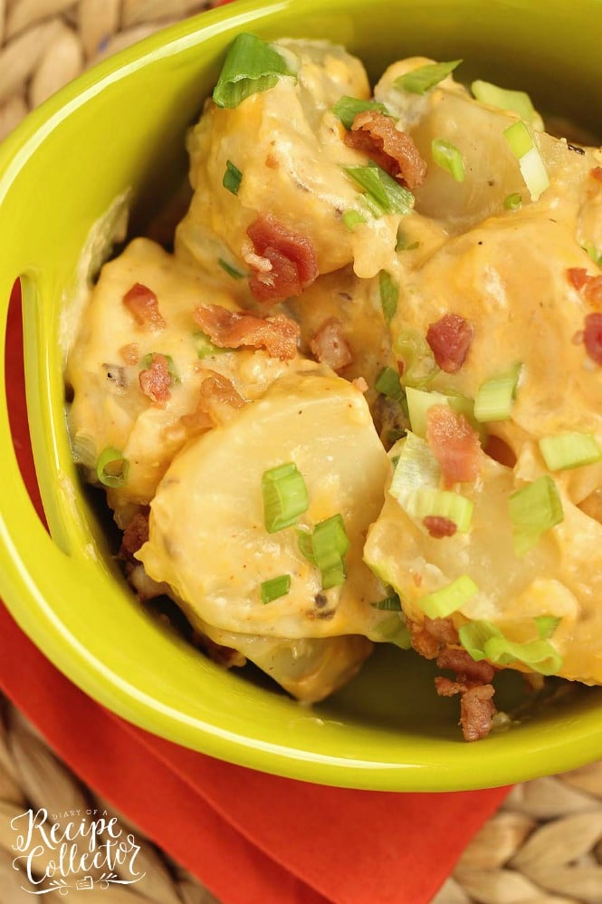 Slow Cooker Loaded Potatoes - An easy side dish recipe filled with all the yummy baked potato toppings and perfect for any time of year!