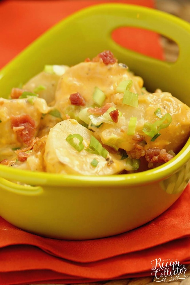 Slow Cooker Loaded Potatoes - An easy side dish recipe filled with all the yummy baked potato toppings and perfect for any time of year!