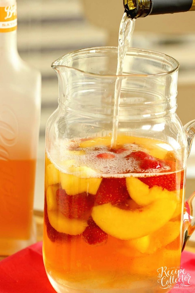 Easy Summer Sangria - A super easy sangria recipe perfect for the beach or the pool!  Plus, it can be made with white or red wine!!