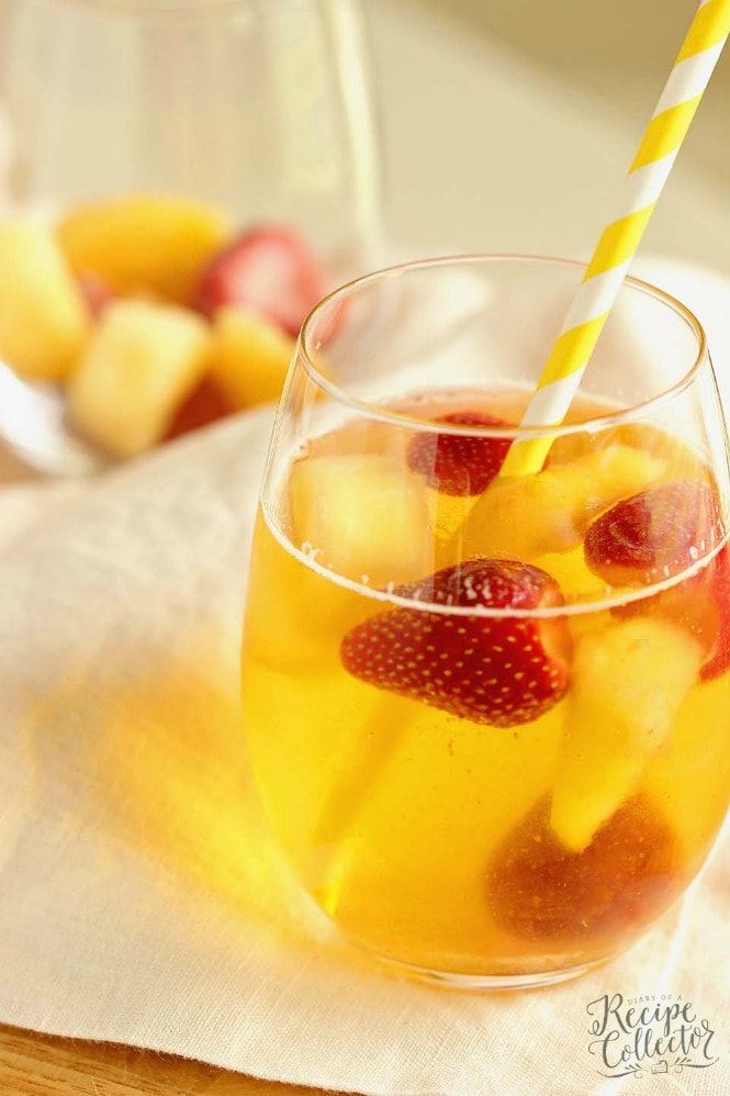 Easy Summer Sangria - A super easy sangria recipe perfect for the beach or the pool!  Plus, it can be made with white or red wine!!