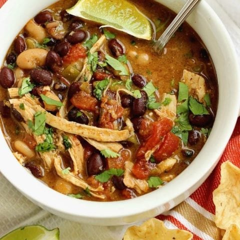 Instant Pot Green Chile Chicken Soup - A quick, easy, and delicious soup recipe filled with beans, green chiles, a little cream cheese, diced tomatoes, and spices.  It's a great weeknight dinner idea and makes several lunches for the week!