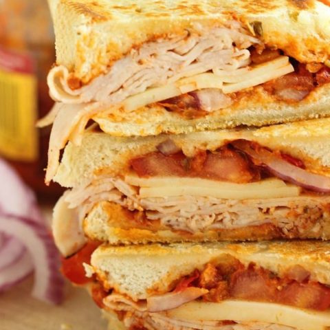 Sun-Dried Tomato Pesto Turkey Panini - An easy grilled sandwich recipe made easy and flavorful with sun-dried tomato pesto.