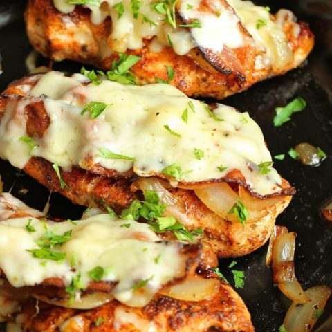 Loaded Blackened Chicken - Seasoned, pan-fried chicken breasts topped with smothered onions, bacon, and pepper jack cheese. You'll definitely want to make this chicken dinner recipe very soon!
