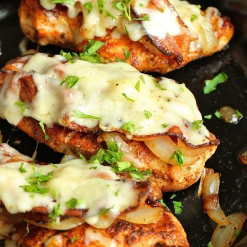 Loaded Blackened Chicken - Seasoned, pan-fried chicken breasts topped with smothered onions, bacon, and pepper jack cheese.  You'll definitely want to make this chicken dinner recipe very soon!