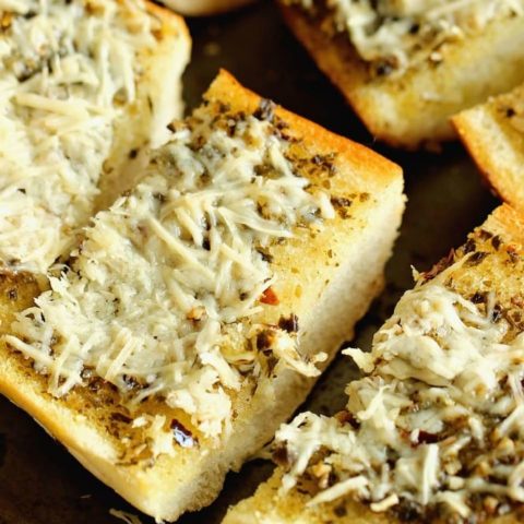 Basil Pesto Loaf - An EASY french bread side dish recipe packed with great flavor!  It's a must make for your next pasta night!