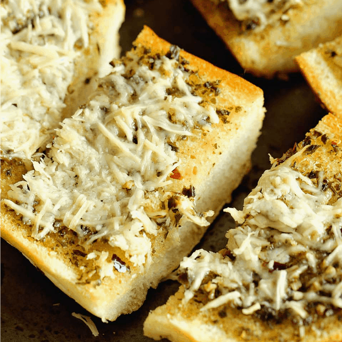 Basil Pesto Loaf - An EASY french bread side dish recipe packed with great flavor!  It's a must make for your next pasta night!