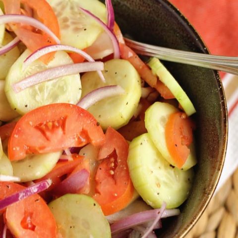 Cucumber, Tomato, and Onion Salad- A wonderful make-ahead salad recipe to use up those fresh garden vegetables!  It makes a great side dish to so many meals!