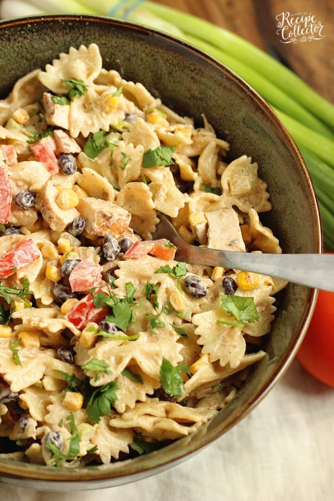 Southwestern Pasta Salad - A creamy pasta salad filled with grilled chicken, black beans, corn, tomatoes, green chiles, cilantro, green onions, and Mexican spices.  