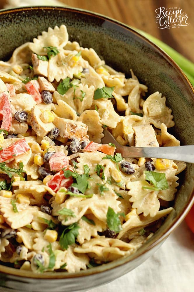 Southwestern Pasta Salad - A creamy pasta salad filled with grilled chicken, black beans, corn, tomatoes, green chiles, cilantro, green onions, and Mexican spices.  