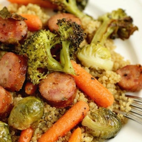 Easy Sheet Pan Sausage and Veggies over Quinoa - A super easy healthy recipe great for make ahead lunches and dinners filled with chicken sausage, veggies, and spices.