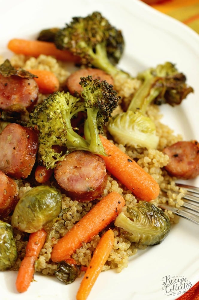 Easy Sheet Pan Sausage and Veggies over Quinoa - A super easy healthy recipe great for make ahead lunches and dinners filled with chicken sausage, veggies, and spices.