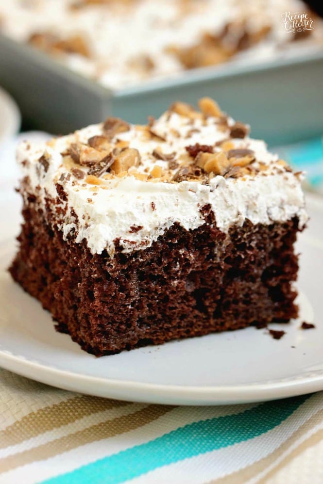 Best Ever Heath Bar Poke Cake - Chocolate cake soaked in sweetened condensed milk, caramel, and hot fudge and topped with heath bar bits and whipped cream.  This is the easiest and most delicious make-ahead dessert ever!