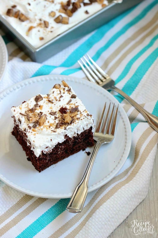 Best Ever Heath Bar Poke Cake - Chocolate cake soaked in sweetened condensed milk, caramel, and hot fudge and topped with heath bar bits and whipped cream.  This is the easiest and most delicious make-ahead dessert ever!