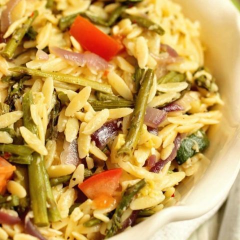 Roasted Vegetable Orzo Salad - Roasted asparagus, red onion, and zucchini tossed with orzo pasta, Italian dressing, balsamic vinegar, and parmesan for an easy flavorful side dish recipe.
