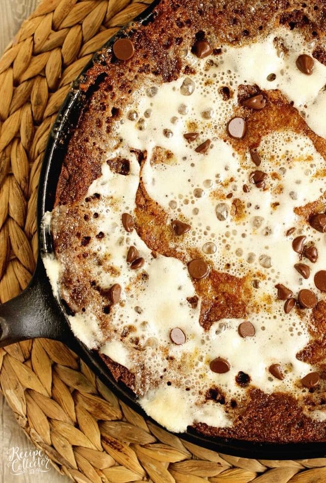 S'mores Skillet Cookie Pie - An easy and decadent skillet cookie filled with graham crackers, chocolate, and marshmallows.  This dessert is going to be a FAVORITE!