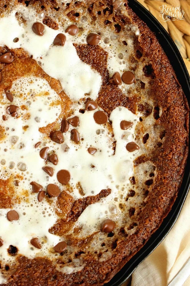 S'mores Skillet Cookie Pie - An easy and decadent skillet cookie filled with graham crackers, chocolate, and marshmallows.  This dessert is going to be a FAVORITE!