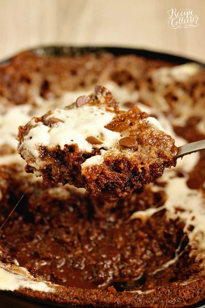 S'mores Skillet Cookie Pie - An easy and decadent skillet cookie filled with graham crackers, chocolate, and marshmallows.  This dessert is going to be a FAVORITE!