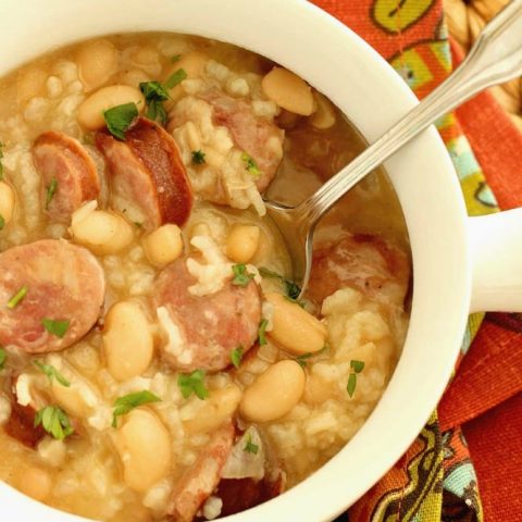Instant Pot White Beans, Sausage, and Rice - It only takes minutes and a few ingredients to make this easy all in one pot meal filled with smoked sausage, white beans, rice, and some spice.