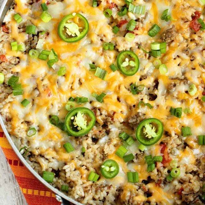 One-Pot Beef Taco Rice - An easy all in one recipe filled with beef, rice, spices, and cheese.  It's a perfect weeknight dinner idea!