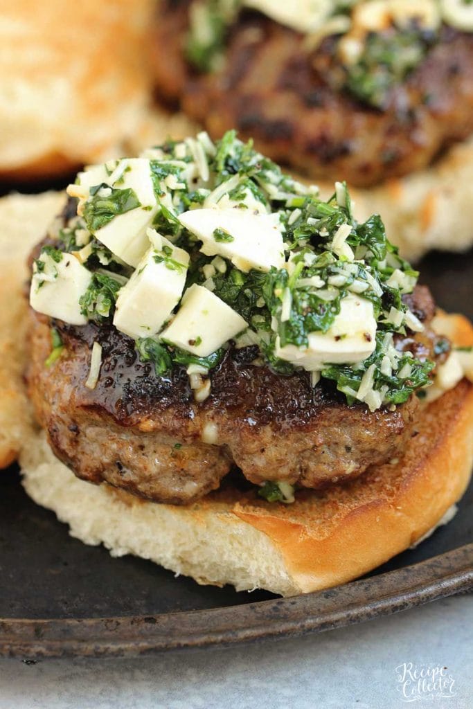 Arugula Spinach Pesto Burgers - Delicious burgers topped with a quick spinach, arugula, parmesan, and mozzarella mix.  These are amazing!