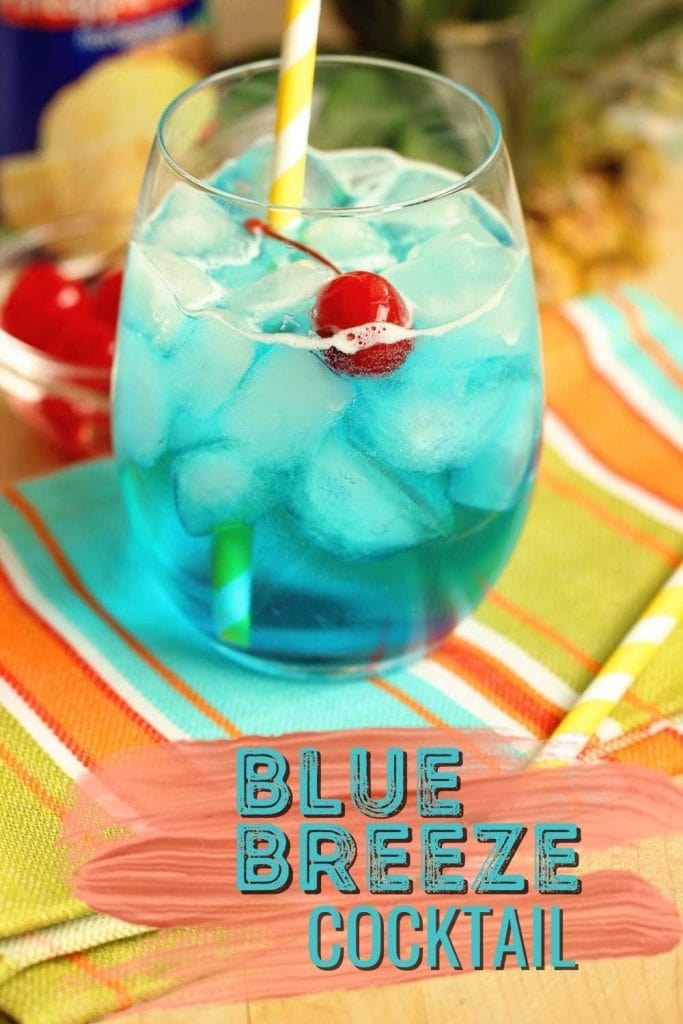 Blue Breeze Cocktail - Transport yourself straight to the beach with this tropical cocktail made with coconut rum, blue curacao, pineapple nectar, and Sprite.