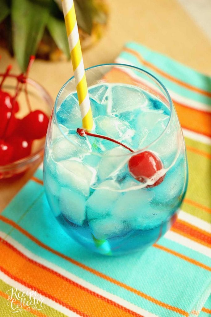 Blue Breeze Cocktail - Transport yourself straight to the beach with this tropical cocktail made with coconut rum, blue curacao, pineapple nectar, and Sprite.