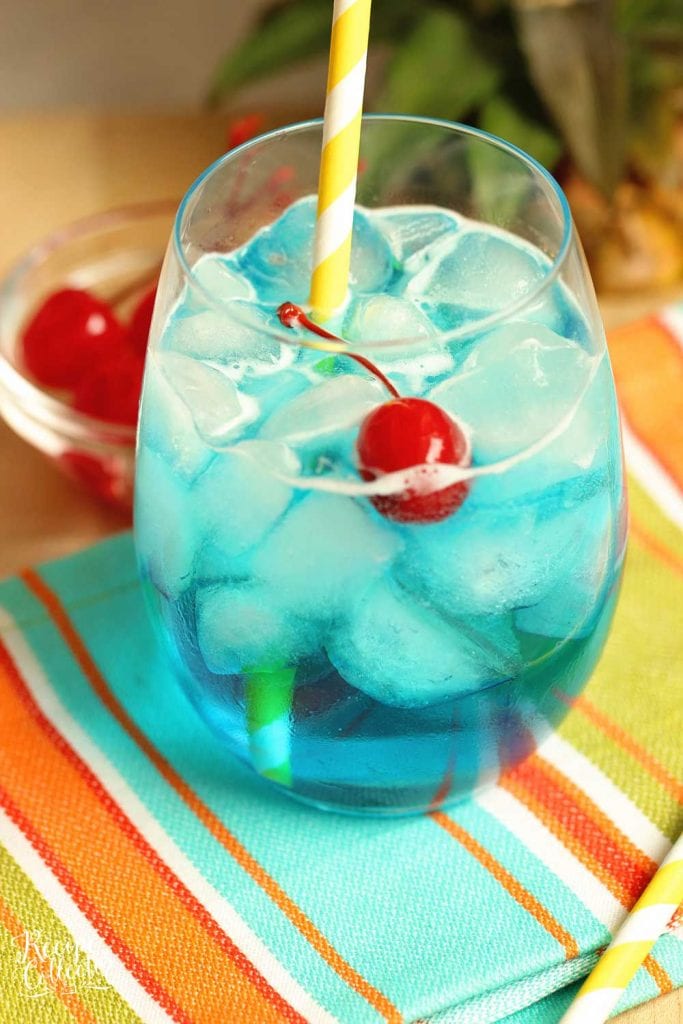 Blue Breeze Cocktail - Transport yourself straight to the beach with this tropical cocktail made with coconut rum, blue curacao, pineapple nectar, and Sprite.