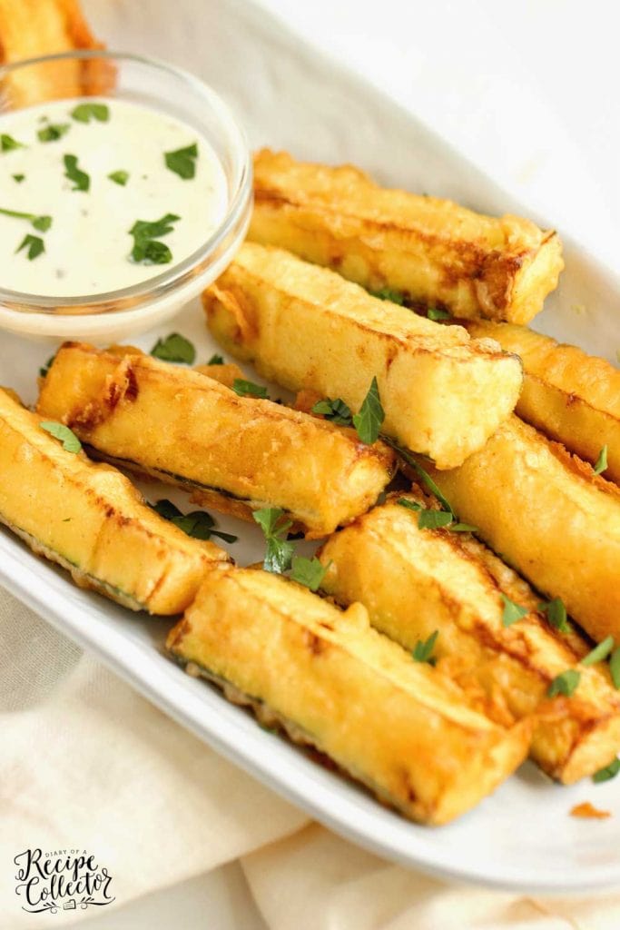Cajun Fried Zucchini - This easy recipe uses one bowl to prep a delicious cold water Cajun batter.  Serve them warm with your favorite ranch dressing!