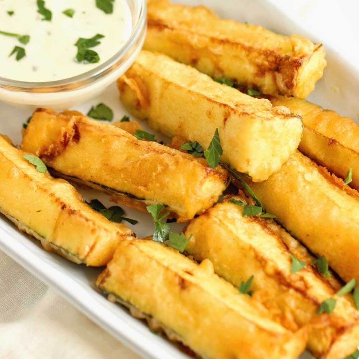 Cajun Fried Zucchini - This easy recipe uses one bowl to prep a delicious cold water Cajun batter.  Serve them warm with your favorite ranch dressing!