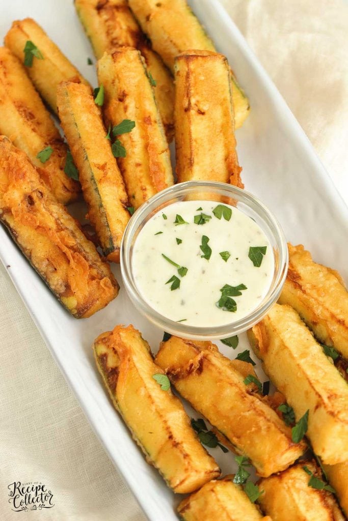 Cajun Fried Zucchini - This easy recipe uses one bowl to prep a delicious cold water Cajun batter.  Serve them warm with your favorite ranch dressing!