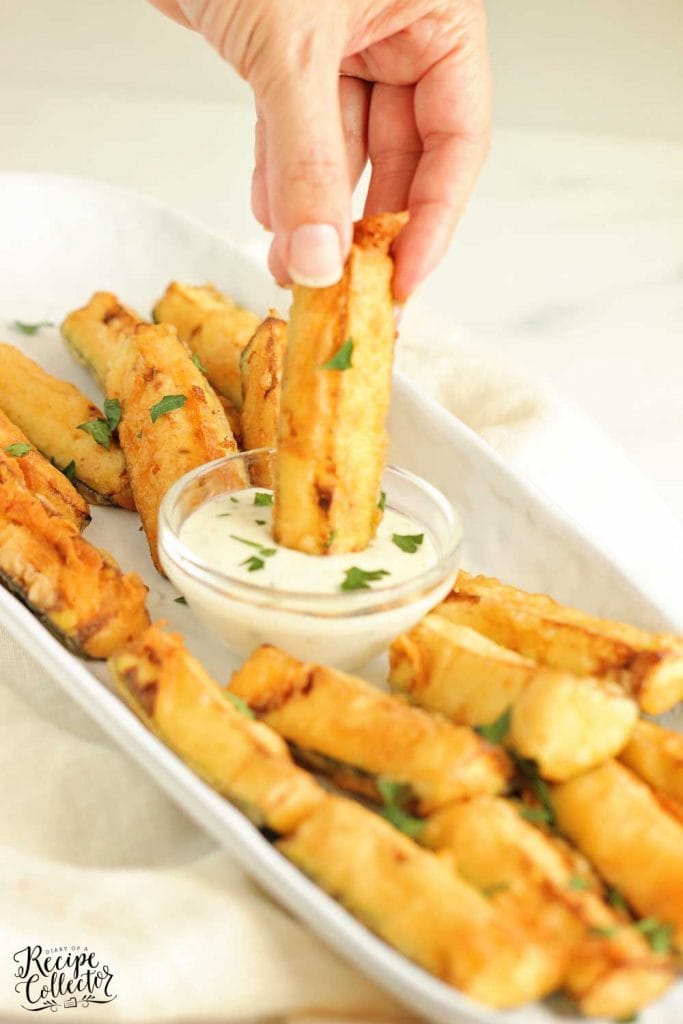 Cajun Fried Zucchini - This easy recipe uses one bowl to prep a delicious cold water Cajun batter.  Serve them warm with your favorite ranch dressing!