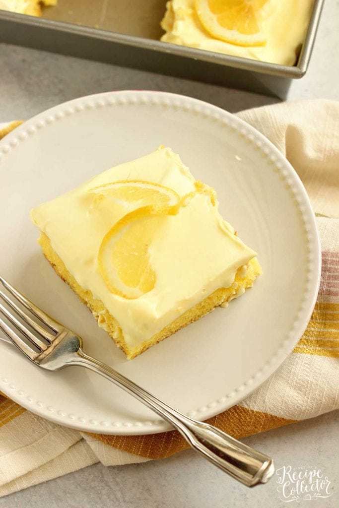 Triple Lemon Poke Cake - An easy lemon cake baked with lemon curd, filled with more lemon curd, and topped with a lemon pudding icing.