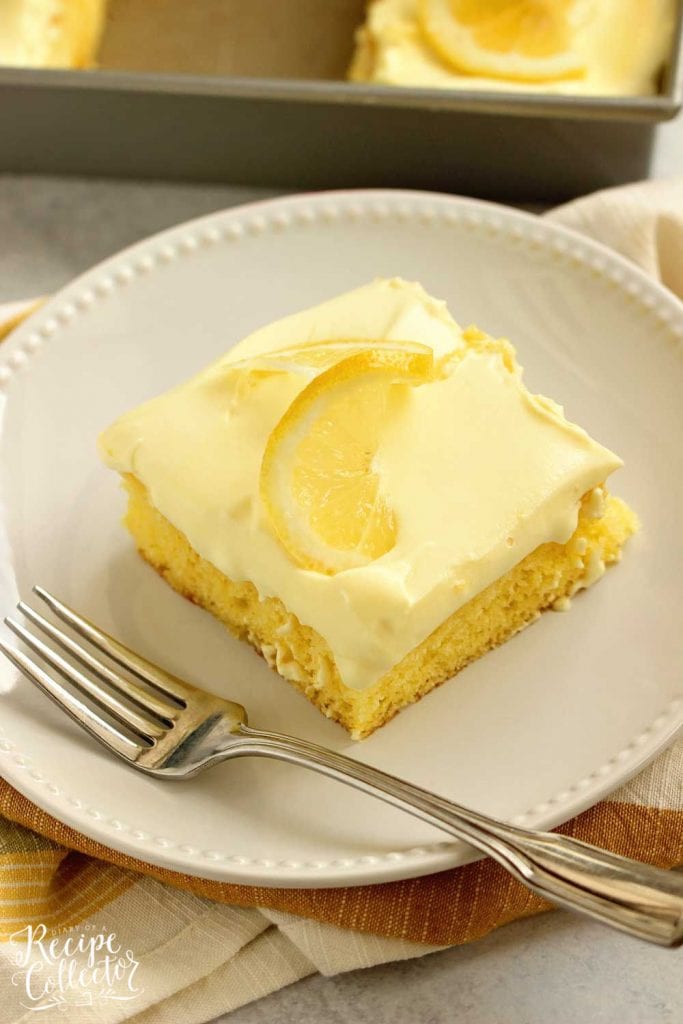 Triple Lemon Poke Cake - An easy lemon cake baked with lemon curd, filled with more lemon curd, and topped with a lemon pudding icing.