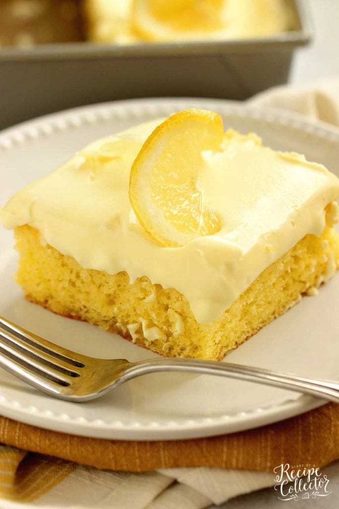 Triple Lemon Poke Cake - An easy lemon cake baked with lemon curd, filled with more lemon curd, and topped with a lemon pudding icing.