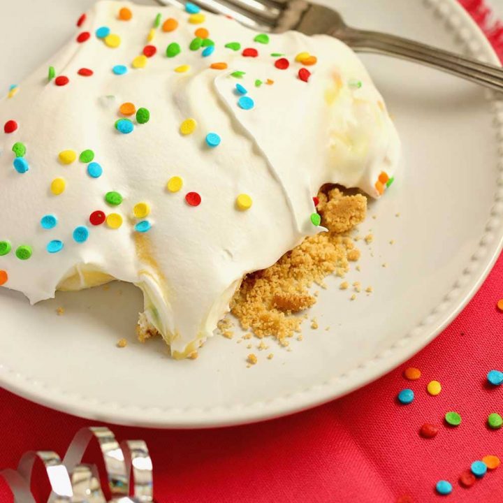 No-Bake Birthday Yummy - Layers of cream cheese pudding and vanilla pudding piled onto a delicious golden oreo cookie crust!