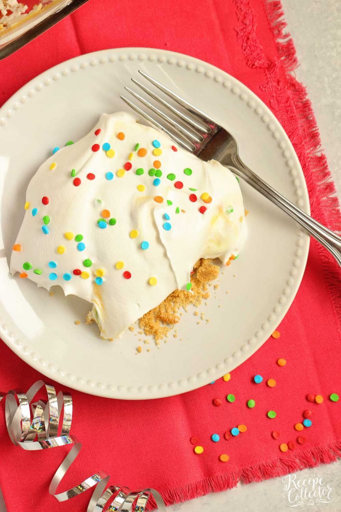 No-Bake Birthday Yummy - Layers of cream cheese pudding and cake batter vanilla pudding piled onto a delicious golden oreo cookie crust!