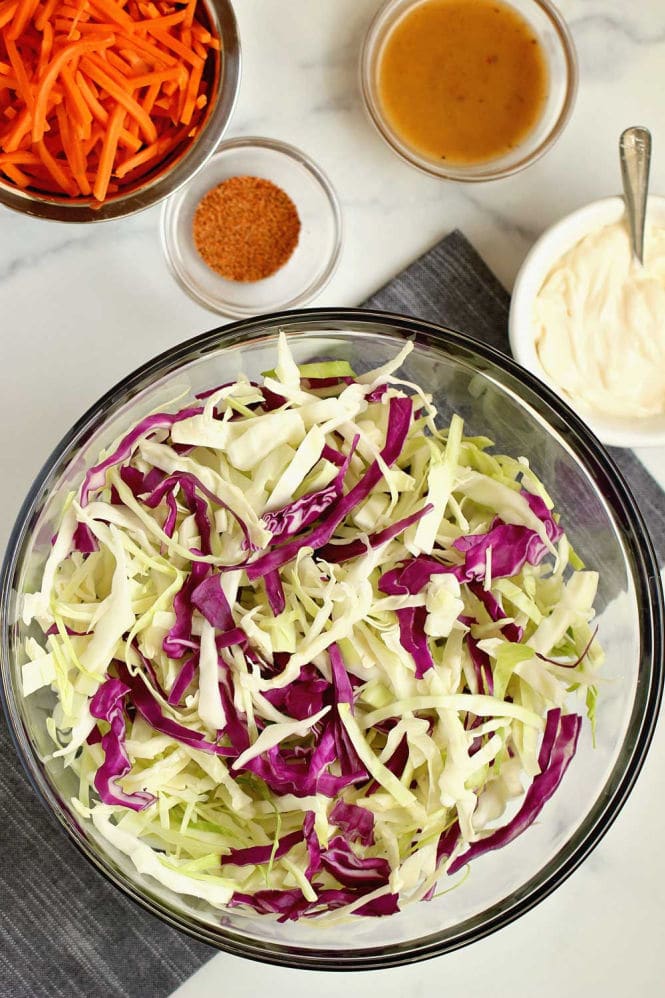 Easy Creole Coleslaw - This quick and easy coleslaw is packed with Cajun Creole flavors and only takes a few ingredients to make!