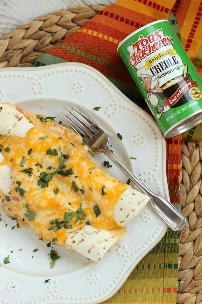 Cheesy Cajun Shrimp Enchiladas - Shrimp smothered in a homemade cheese sauce with Creole spices rolled into flour tortillas and baked. 