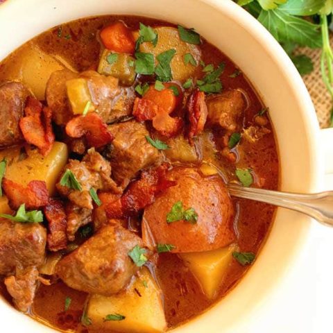 Old-Fashioned Beef Stew - A cozy and hearty stew recipe packed with flavor, topped with crispy bacon, and perfect for those cool nights!