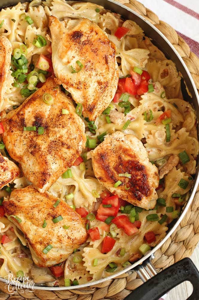 Roasted Garlic Cajun Chicken Pasta - Creole seasoned chicken breasts over bow tie pasta tossed with a delicious roasted garlic cream sauce. 