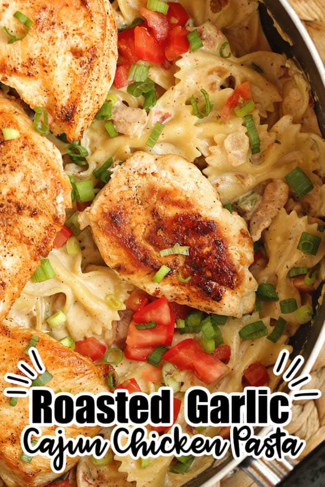 Roasted Garlic Cajun Chicken Pasta - Creole seasoned chicken breasts over bow tie pasta tossed with a delicious roasted garlic cream sauce. 