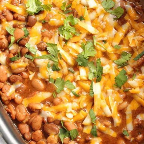 Slow Cooker Mexican Pinto Beans - This is the easiest side dish to all your Mexican themed recipe nights! Add it to your next Taco Tuesday or Fajita Friday!