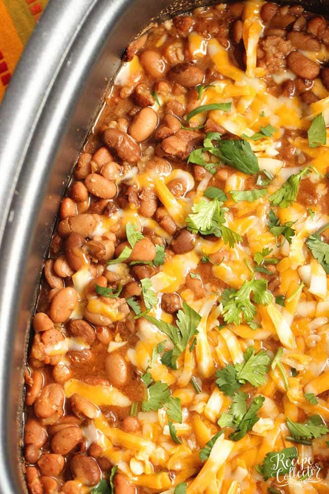 Slow Cooker Mexican Pinto Beans - This is the easiest side dish to all your Mexican themed recipe nights!  Add it to your next Taco Tuesday or Fajita Friday!