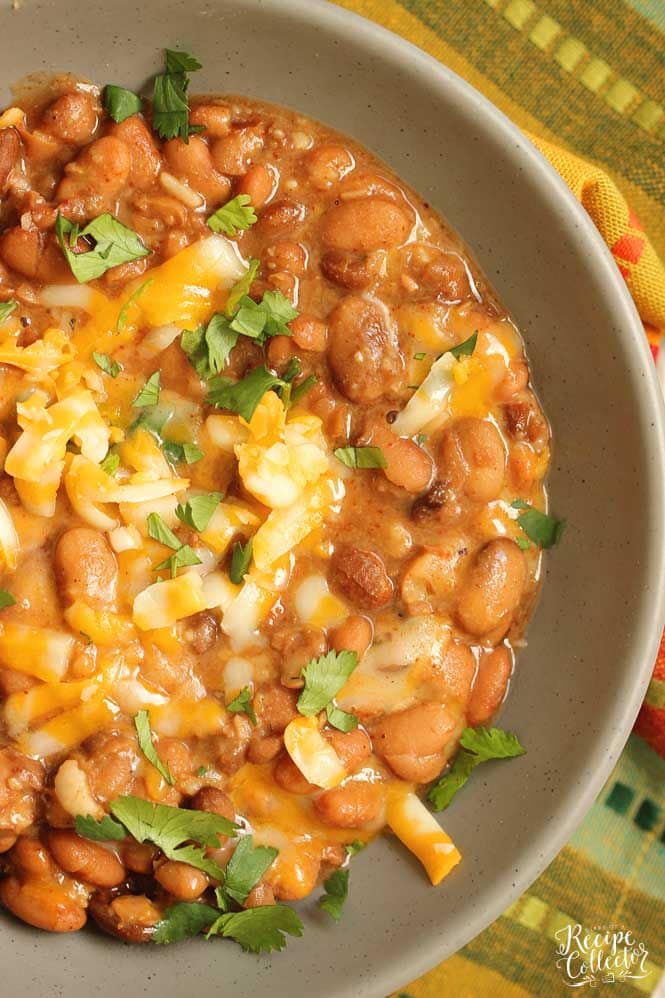 Slow Cooker Mexican Pinto Beans - This is the easiest side dish to all your Mexican themed recipe nights!  Add it to your next Taco Tuesday or Fajita Friday!