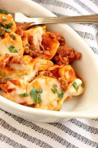 Easy Sausage Tortellini Pasta - This pasta recipe has become a dinner time favorite around here!  It uses only 5 ingredients and cooks in 20 minutes!! You'll never guess what gives it the awesome flavor!
