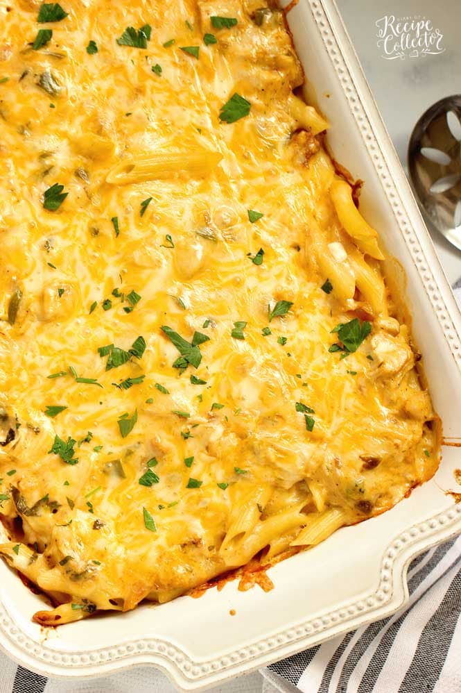 Creamy Chicken Pasta Bake - Layers of cheesy penne noodles topped with layers of a creamy flavorful sauce filled with chopped rotisserie chicken.