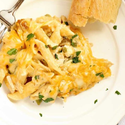 Creamy Chicken Pasta Bake - Layers of cheesy penne noodles topped with layers of a creamy flavorful sauce filled with chopped rotisserie chicken.