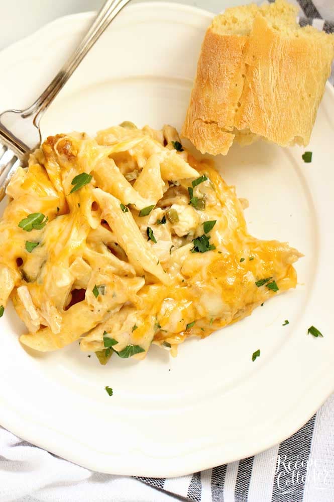 Creamy Chicken Pasta Bake - Layers of cheesy penne noodles topped with layers of a creamy flavorful sauce filled with chopped rotisserie chicken.