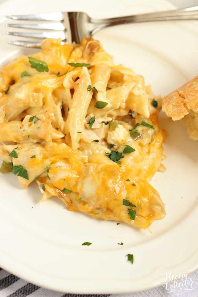 Creamy Chicken Pasta Bake - Layers of cheesy penne noodles topped with layers of a creamy flavorful sauce filled with chopped rotisserie chicken.